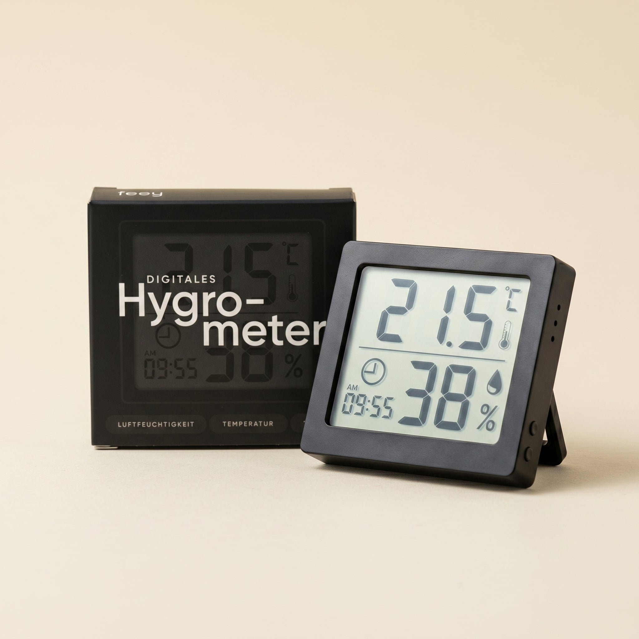 Ein Hygrometer zeigt 21,5°C und 38% Luftfeuchtigkeit an, ideal für die Zimmerpflanzenpflege. Es steht mit seiner schwarzen 